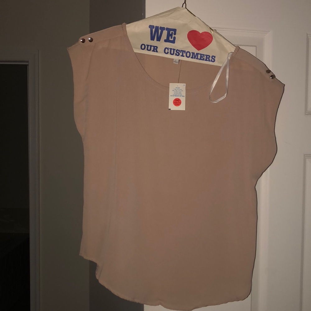 Sleeveless tan blouse